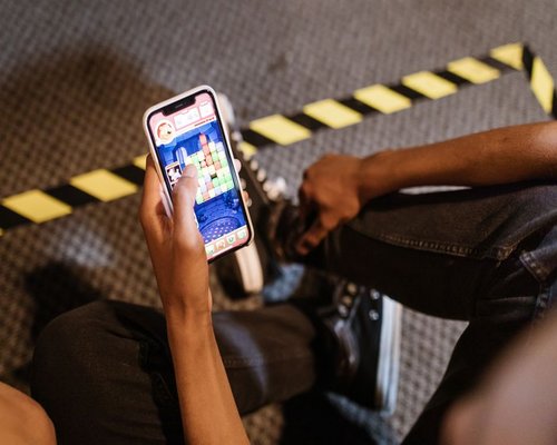 Angled smartphone displaying the fictional Skyline Loop Logic puzzle game